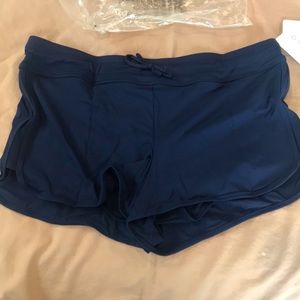 Athleta ‘surge’ swim short navy blue, matches top listed. Never worn w/tags